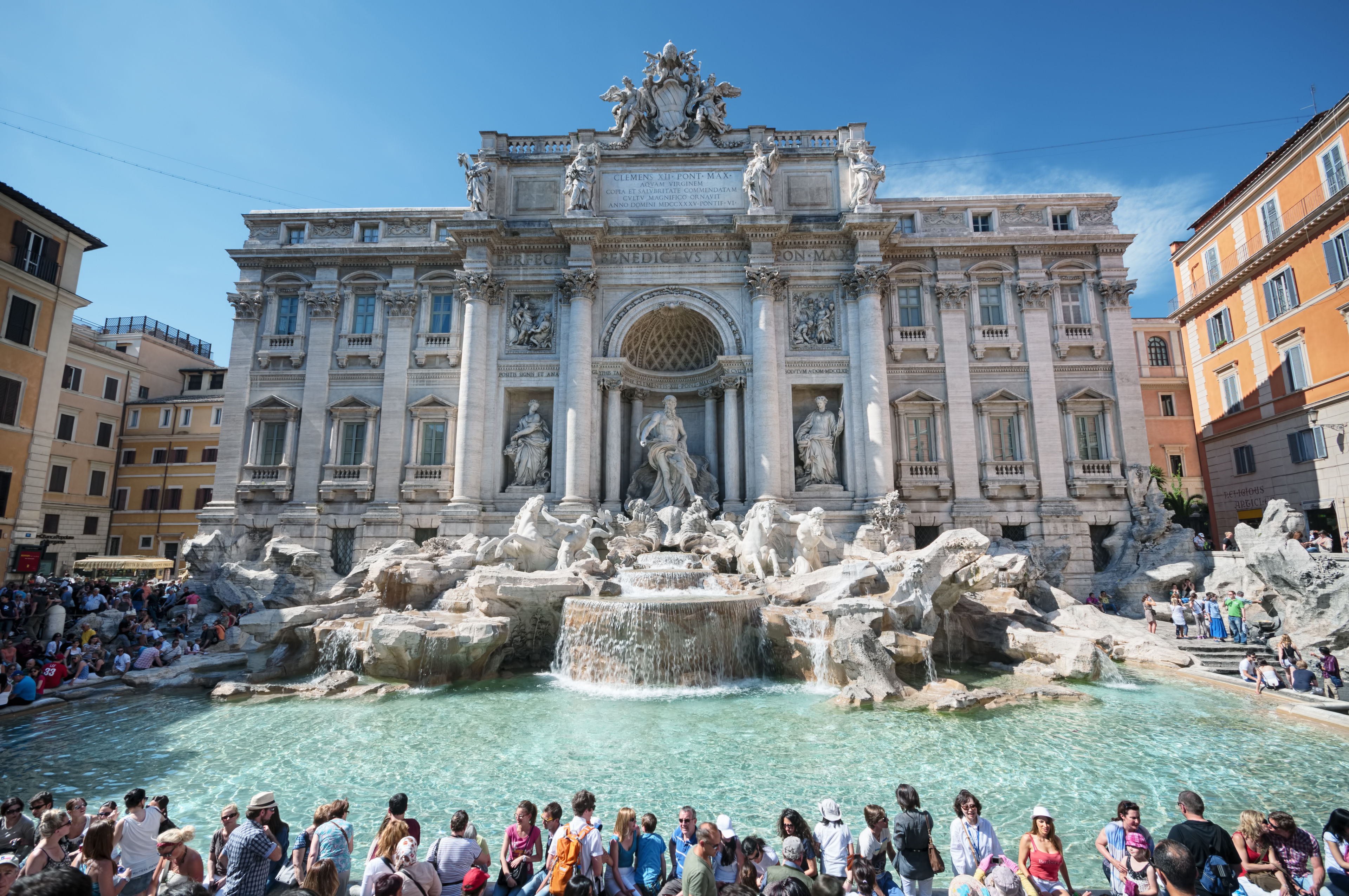 trevi fountain with crowd of tourists.